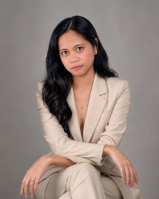 Kyla Manulat wearing a beige suit